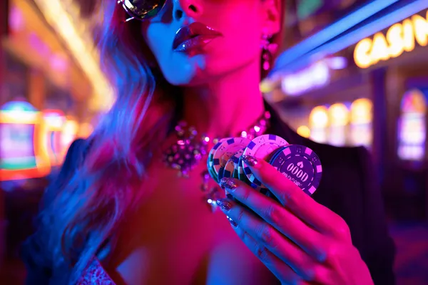 A confident dealer surrounded by casino chips inviting players to access their 599JILI account, reflecting quick and easy login options.